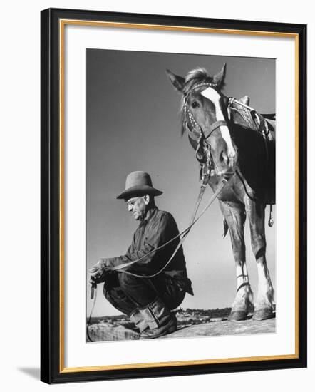 Man Sitting Holding His Horses Reins-Loomis Dean-Framed Photographic Print
