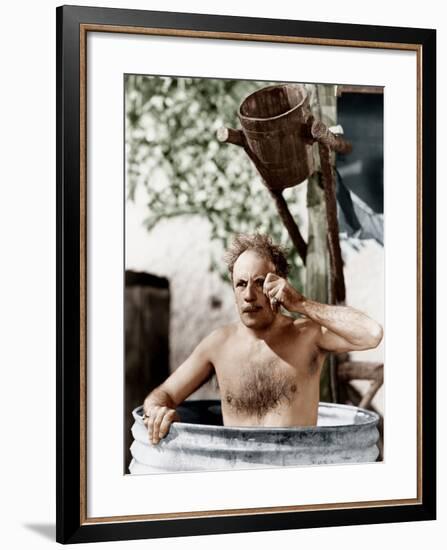 Man Sitting in a Barrel Taking a Bath and Looking Through His Monocle-null-Framed Photo