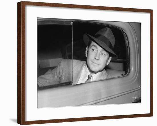 Man Sitting in a Car Looking Out the Window-null-Framed Photo