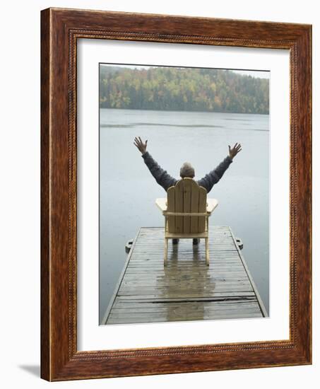 Man Sitting on a Dock with Arms Outstretched-null-Framed Photographic Print