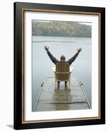 Man Sitting on a Dock with Arms Outstretched-null-Framed Photographic Print
