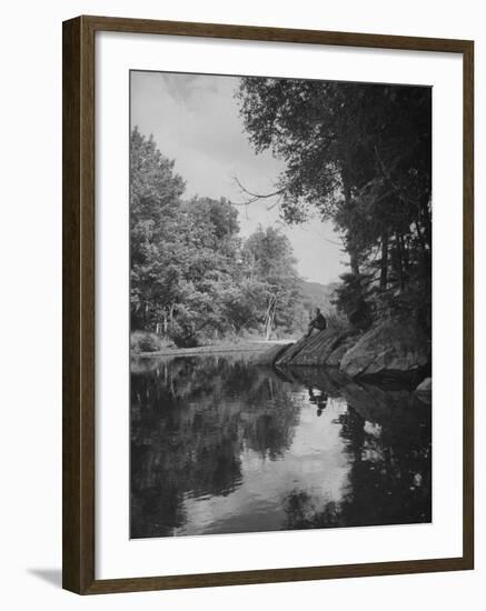 Man Sitting on the Bank of the Upper Opalescent River, a Branch of the Hudson-Margaret Bourke-White-Framed Photographic Print