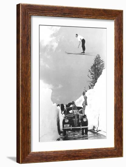 Man Ski-Jumping over Road-null-Framed Art Print