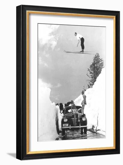 Man Ski-Jumping over Road-null-Framed Art Print