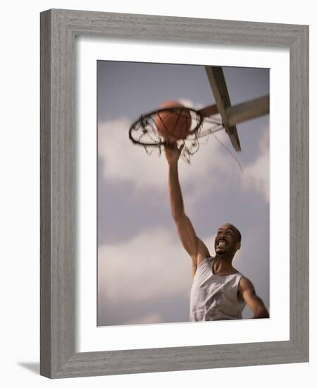 Man Slam-Dunking a Basketball-null-Framed Photographic Print