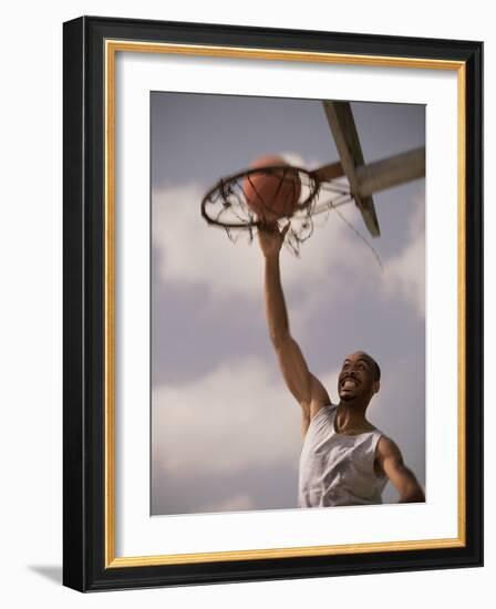 Man Slam-Dunking a Basketball-null-Framed Photographic Print