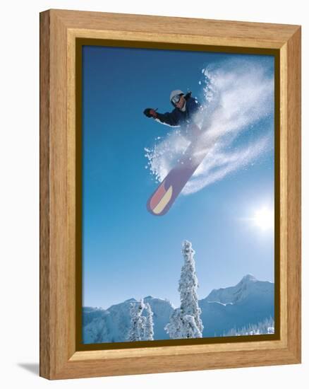 Man snowboarding on sunnny day-Henry Georgi-Framed Premier Image Canvas