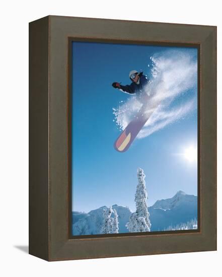 Man snowboarding on sunnny day-Henry Georgi-Framed Premier Image Canvas