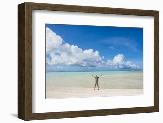 Man standing on a white sand beach in the lagoon of Wallis, Wallis and Futuna, Pacific-Michael Runkel-Framed Photographic Print