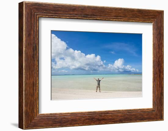 Man standing on a white sand beach in the lagoon of Wallis, Wallis and Futuna, Pacific-Michael Runkel-Framed Photographic Print