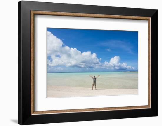 Man standing on a white sand beach in the lagoon of Wallis, Wallis and Futuna, Pacific-Michael Runkel-Framed Photographic Print