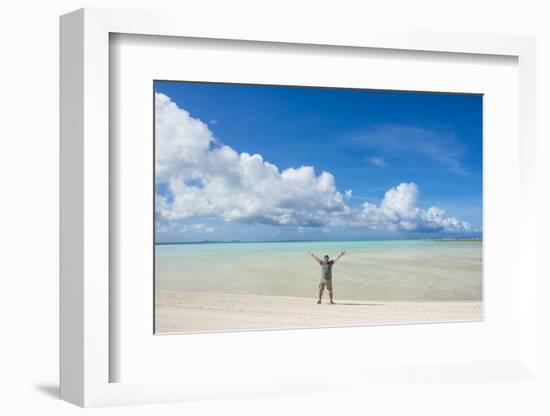 Man standing on a white sand beach in the lagoon of Wallis, Wallis and Futuna, Pacific-Michael Runkel-Framed Photographic Print