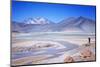 Man Standing on Rocks Looking over Miscanti Laguna, Turquoise Mineral Lake, San Pedro De Atacama-Kimberly Walker-Mounted Photographic Print