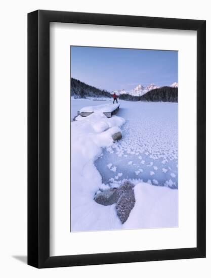 Man standing on the shore of frozen lake, Lej da Staz, St. Moritz, Engadine, Canton of Graubunden (-Roberto Moiola-Framed Photographic Print