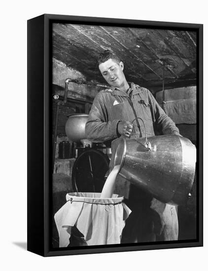 Man Straining Milk into a Can Through a Piece of Cloth-Hansel Mieth-Framed Premier Image Canvas