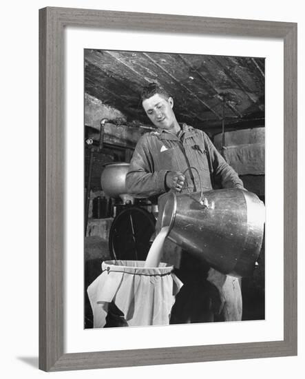 Man Straining Milk into a Can Through a Piece of Cloth-Hansel Mieth-Framed Premium Photographic Print