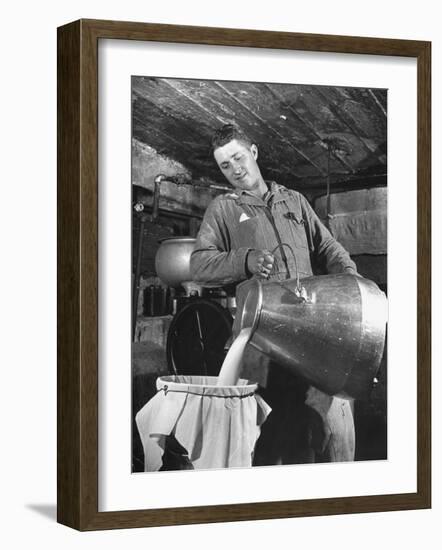 Man Straining Milk into a Can Through a Piece of Cloth-Hansel Mieth-Framed Photographic Print