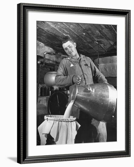 Man Straining Milk into a Can Through a Piece of Cloth-Hansel Mieth-Framed Photographic Print