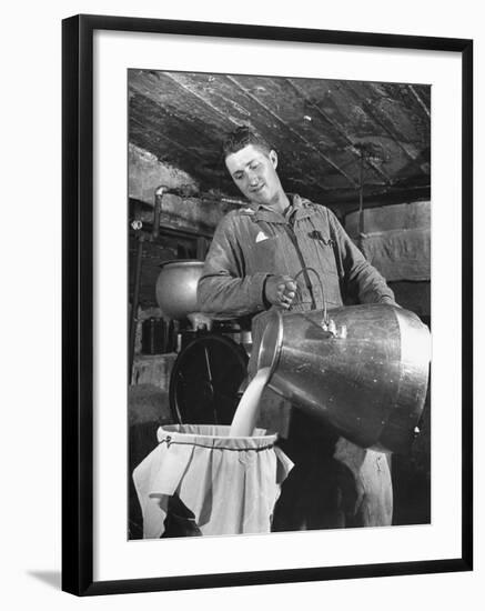 Man Straining Milk into a Can Through a Piece of Cloth-Hansel Mieth-Framed Photographic Print