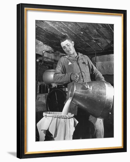 Man Straining Milk into a Can Through a Piece of Cloth-Hansel Mieth-Framed Photographic Print