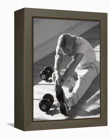 Man Stretching in Gym, New York, New York, USA-Chris Trotman-Framed Premier Image Canvas