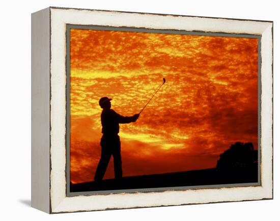 Man Swinging Golf Club at Sunset-Bill Bachmann-Framed Premier Image Canvas