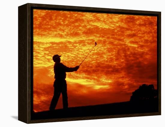 Man Swinging Golf Club at Sunset-Bill Bachmann-Framed Premier Image Canvas