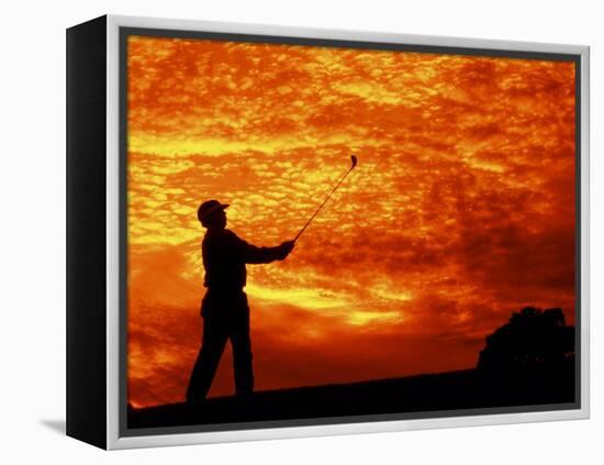 Man Swinging Golf Club at Sunset-Bill Bachmann-Framed Premier Image Canvas