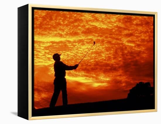 Man Swinging Golf Club at Sunset-Bill Bachmann-Framed Premier Image Canvas