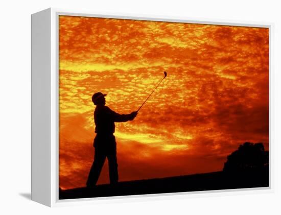 Man Swinging Golf Club at Sunset-Bill Bachmann-Framed Premier Image Canvas