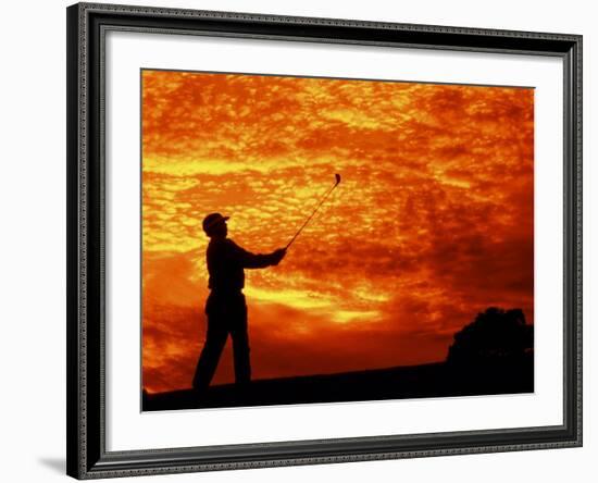 Man Swinging Golf Club at Sunset-Bill Bachmann-Framed Photographic Print