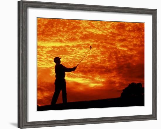 Man Swinging Golf Club at Sunset-Bill Bachmann-Framed Photographic Print