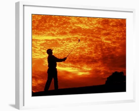 Man Swinging Golf Club at Sunset-Bill Bachmann-Framed Photographic Print