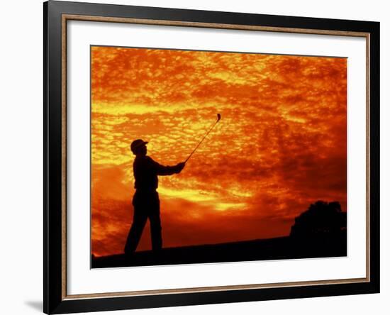Man Swinging Golf Club at Sunset-Bill Bachmann-Framed Photographic Print