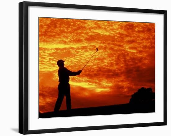 Man Swinging Golf Club at Sunset-Bill Bachmann-Framed Photographic Print