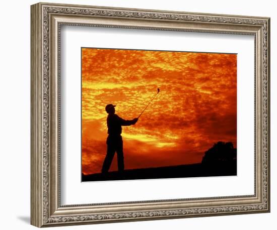 Man Swinging Golf Club at Sunset-Bill Bachmann-Framed Photographic Print