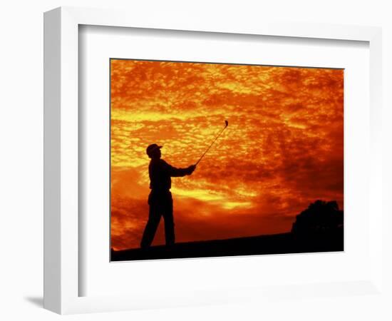 Man Swinging Golf Club at Sunset-Bill Bachmann-Framed Photographic Print