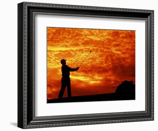 Man Swinging Golf Club at Sunset-Bill Bachmann-Framed Photographic Print