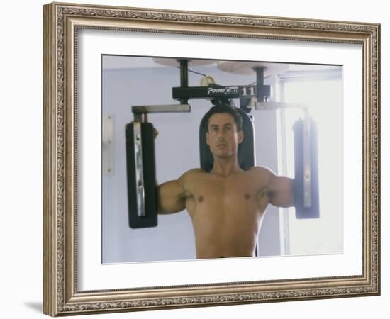 Man Using Exercise Machine-null-Framed Photographic Print