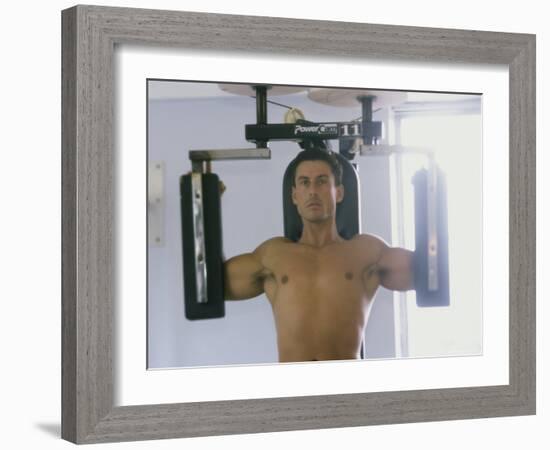 Man Using Exercise Machine-null-Framed Photographic Print