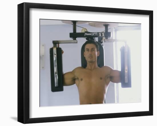 Man Using Exercise Machine-null-Framed Photographic Print