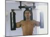 Man Using Exercise Machine-null-Mounted Photographic Print