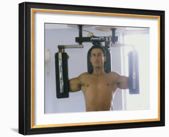 Man Using Exercise Machine-null-Framed Photographic Print