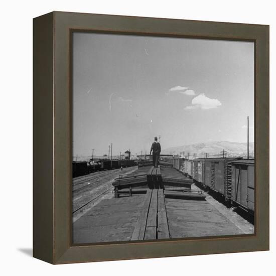 Man Walking Atop a Freight Train Heading Westbound-Sam Shere-Framed Premier Image Canvas
