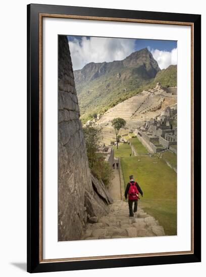 Man Walking Down Stone Steps of Machu Picchu, Peru-Merrill Images-Framed Photographic Print