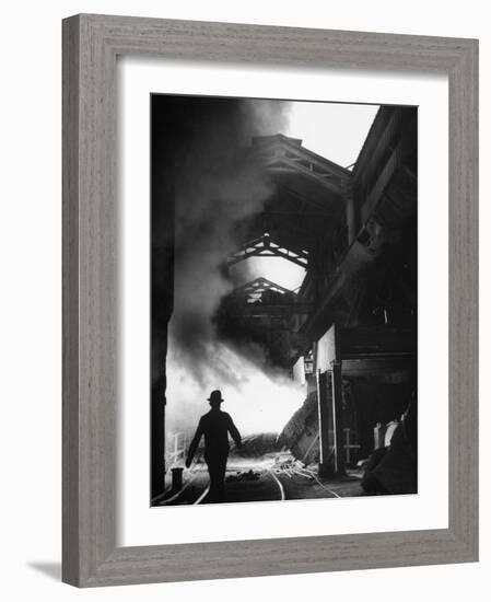 Man Walking in the Smokey Steel Mill-Nat Farbman-Framed Photographic Print