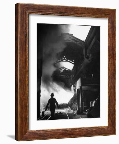 Man Walking in the Smokey Steel Mill-Nat Farbman-Framed Photographic Print