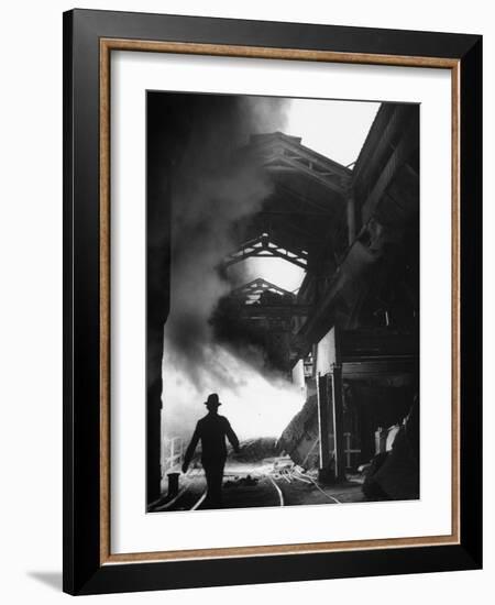 Man Walking in the Smokey Steel Mill-Nat Farbman-Framed Photographic Print