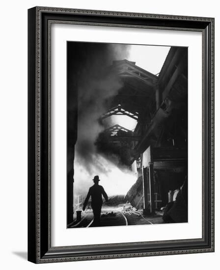 Man Walking in the Smokey Steel Mill-Nat Farbman-Framed Photographic Print