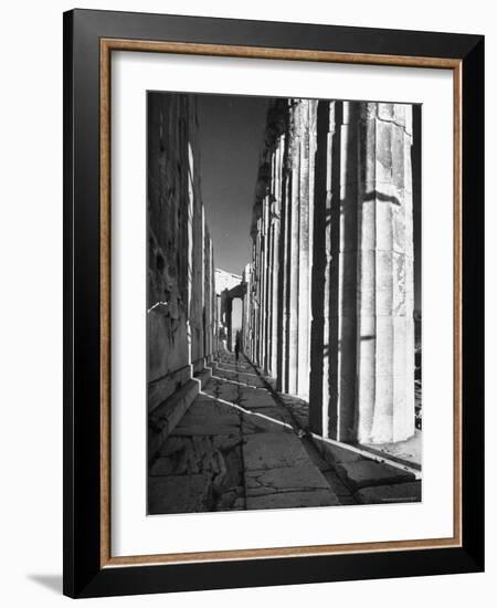 Man Walking Through the Remains of an Ancient Temple in Athens-Dmitri Kessel-Framed Photographic Print